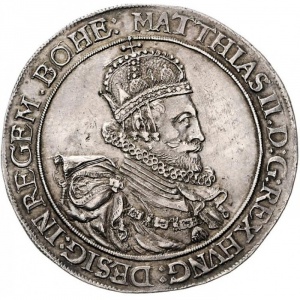 Аверс монеты Австрия, 1 талер, 1609-1610, Маттиас, короткие складки ткани за бюстом