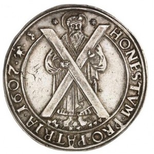 Реверс монеты Брауншвейг-Вольфенбюттель, 1 талер, 1601-1611, Святой держит крест, смотрит вправо