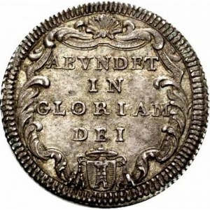 Реверс монеты Папская область, 1 джулио, 1734-1737, Надпись на реверсе: "ABVNDET IN GLORIAM DEI" в картуше