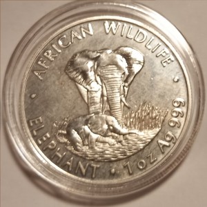 Реверс монеты Замбия, 5000 квач, 1999, Дикая природа Африки - Слон /Cлон и слоненок в воде/