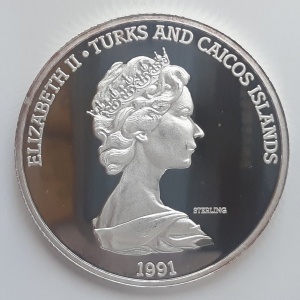 Аверс монеты Тёркс и Кайкос, 20 крон, 1991, 500 лет открытию Америки. Колумб претендует на новые земли для Испании